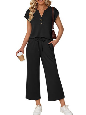 Black notched V-neck top with drawstring wide-leg pants set.