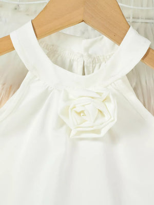 White powder toddler top with halter neck and fabric rose applique.