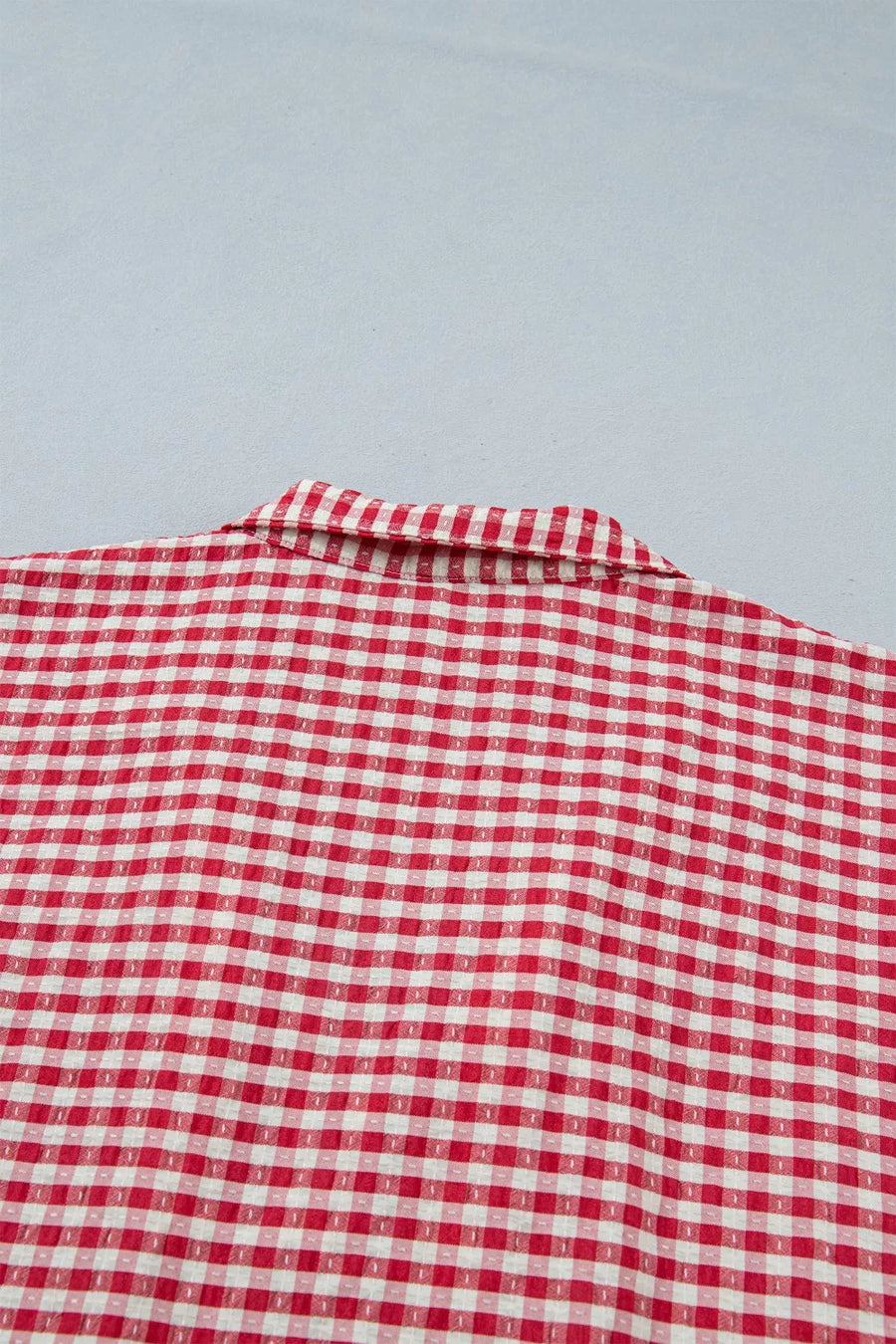 Strawberry gingham checkered maternity overshirt with a collared neckline.