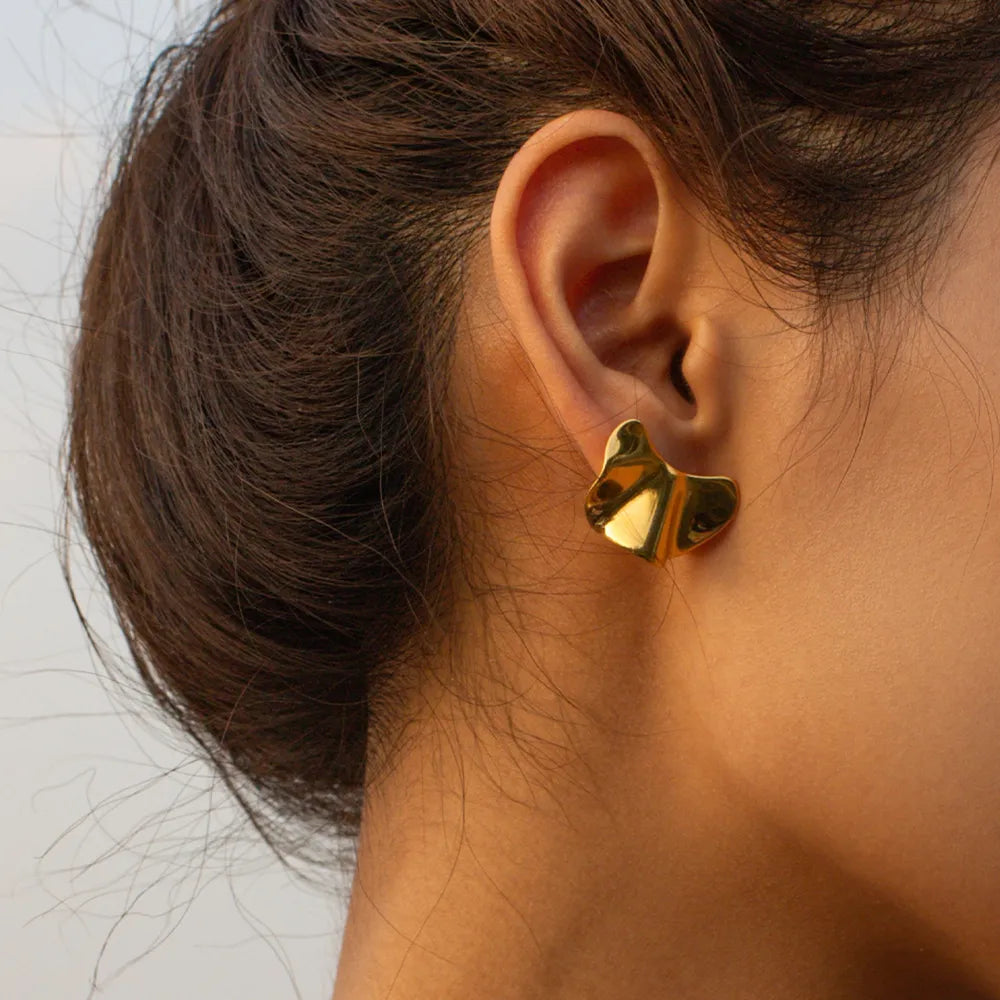 Sculpted gold petal stud earrings with a polished finish.