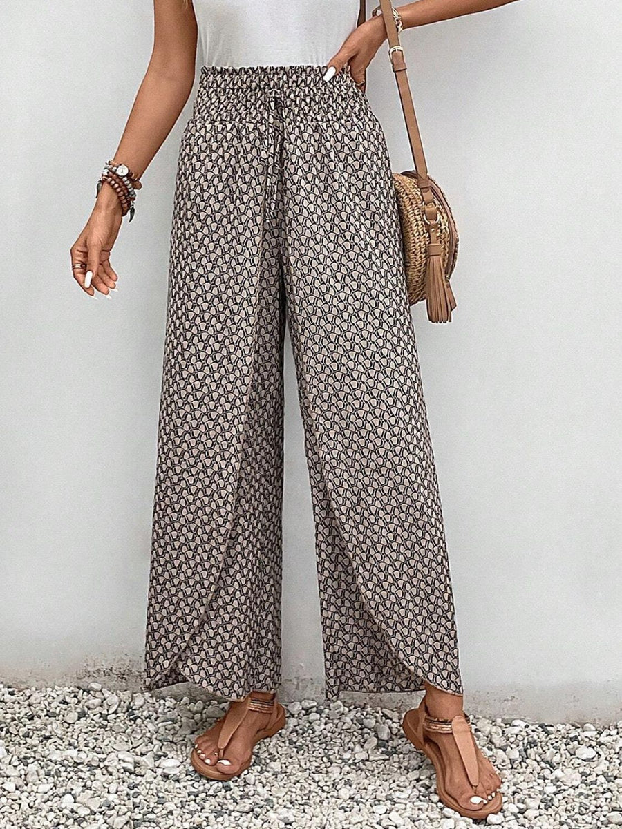 Palazzo pants with a geometric print and drawstring waist.
