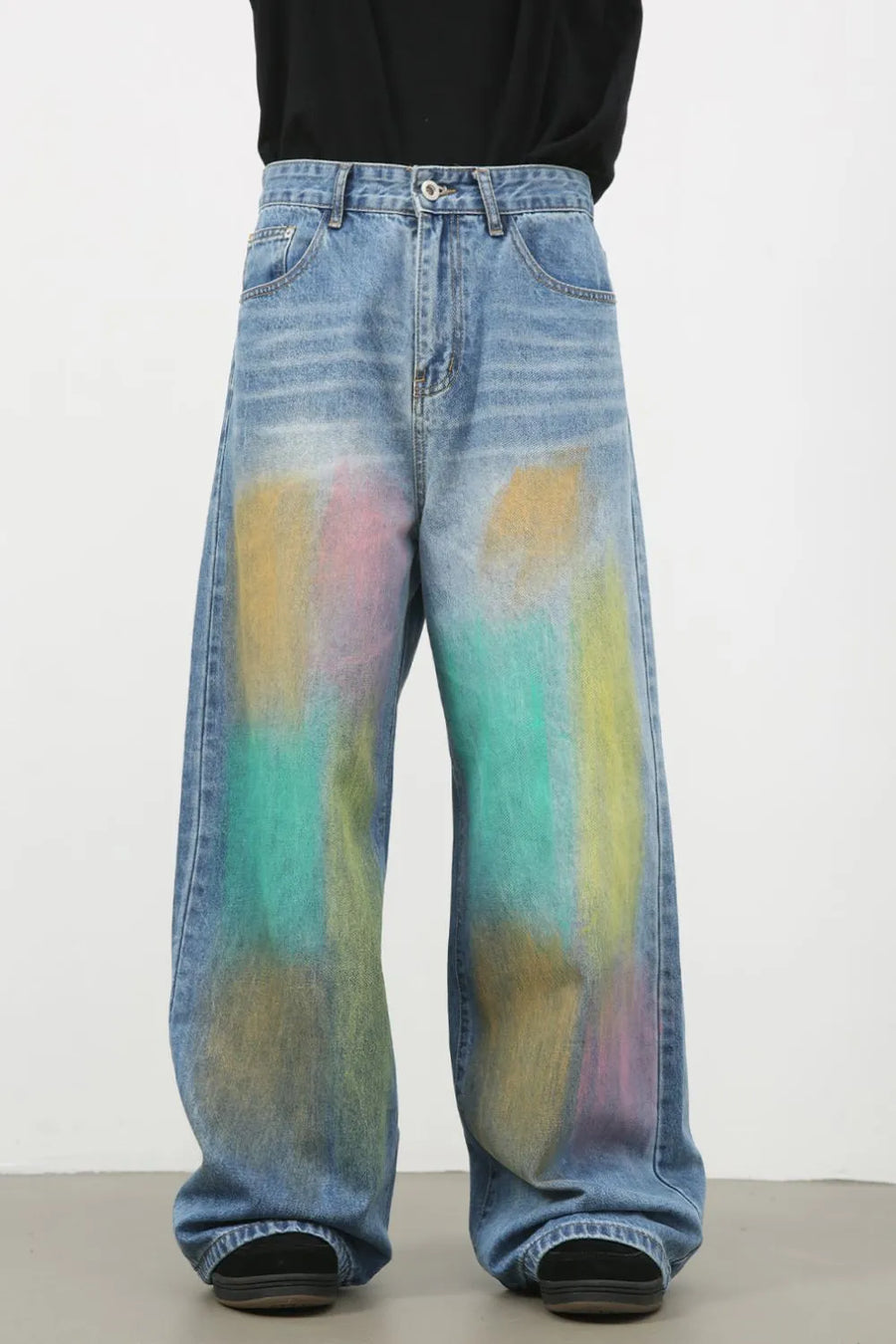 Graffiti wash wide leg denim trousers in medium blue with abstract paint splatters.