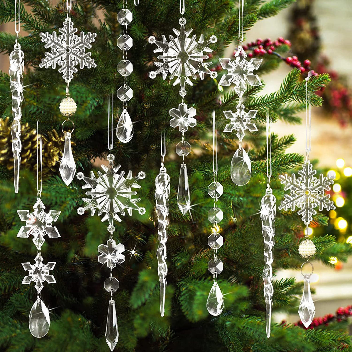 Transparent acrylic snowflake and icicle Christmas ornaments cascade on a tree.