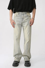 Vintage wash flare denim trousers in light blue with a relaxed fit and subtle fading.