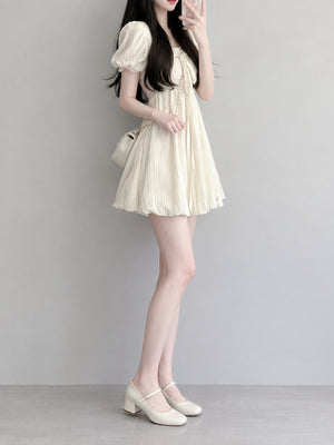 Polyester (70% to less than 80%) and spandex (less than 30%) mini dress in Cream with A-line silhouette