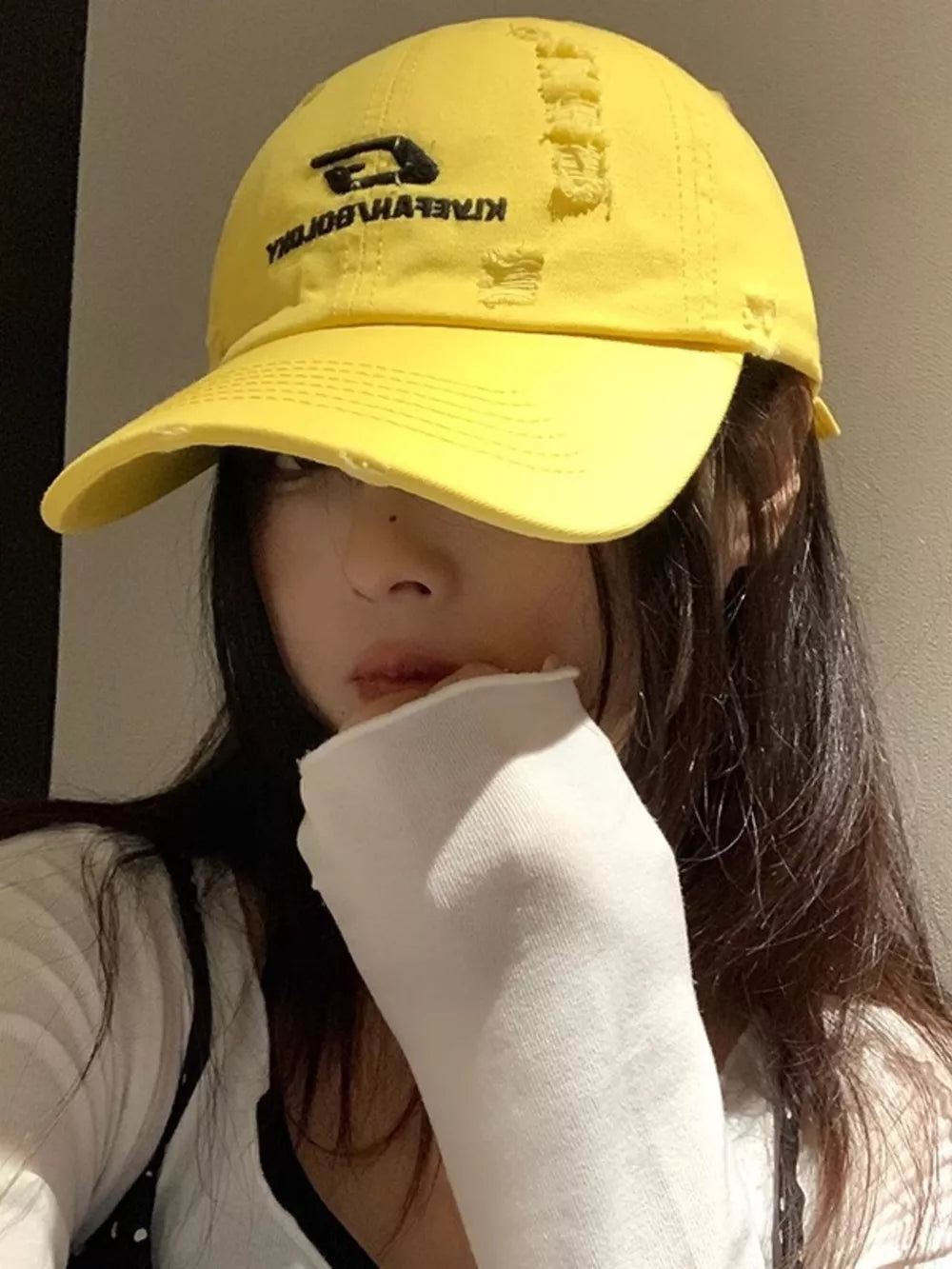 Yellow distressed cotton baseball hat with embroidered logo
