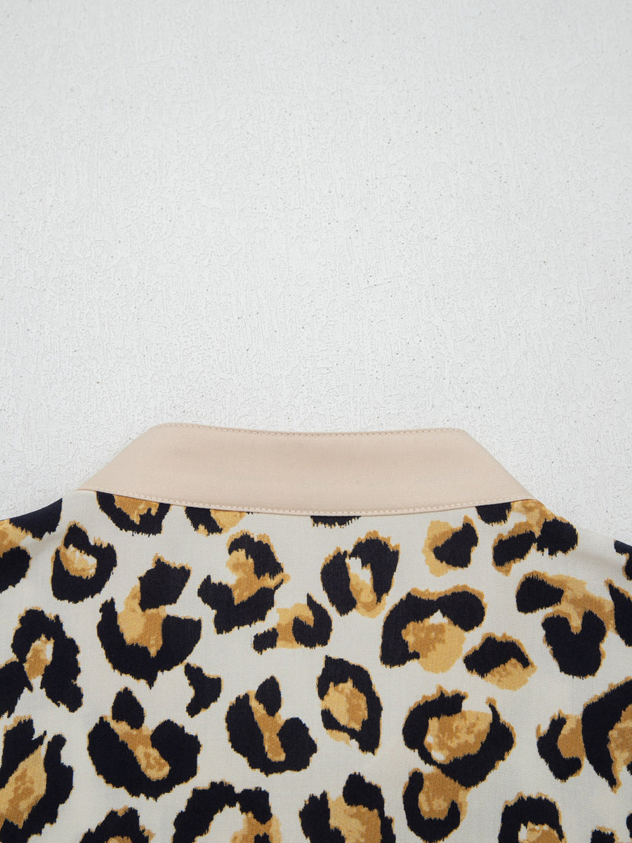 Print button-down shirt with leopard pattern and beige collar detail.