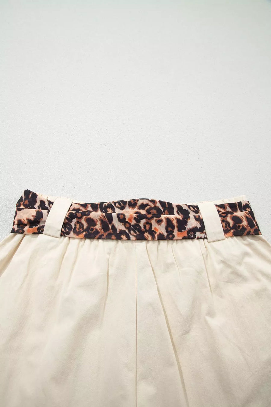 Cream skirt with leopard print tie waist and cream belt loops