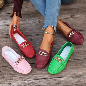 Chic round-toe loafers with gold chain detail in pink, red, burgundy, and green.
