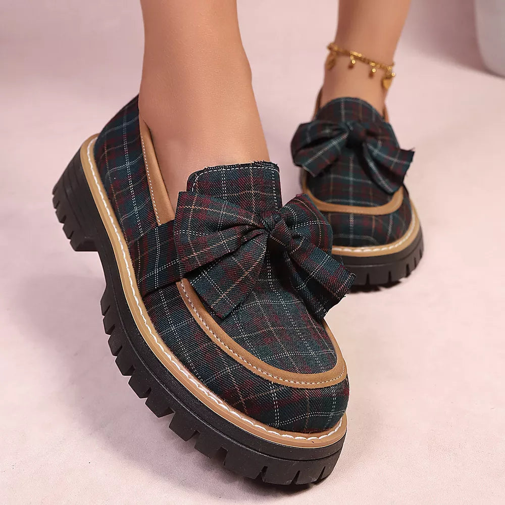 Plaid chunky loafers with bow accent and lug sole.
