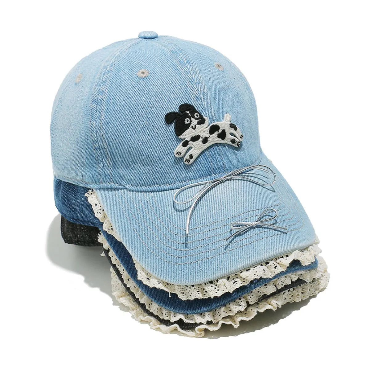 Light blue denim baseball cap with puppy appliqué, lace trim, and bow details.