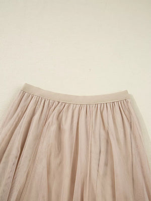 Lace overlay flared midi skirt in beige with elastic waistband and tulle fabric.