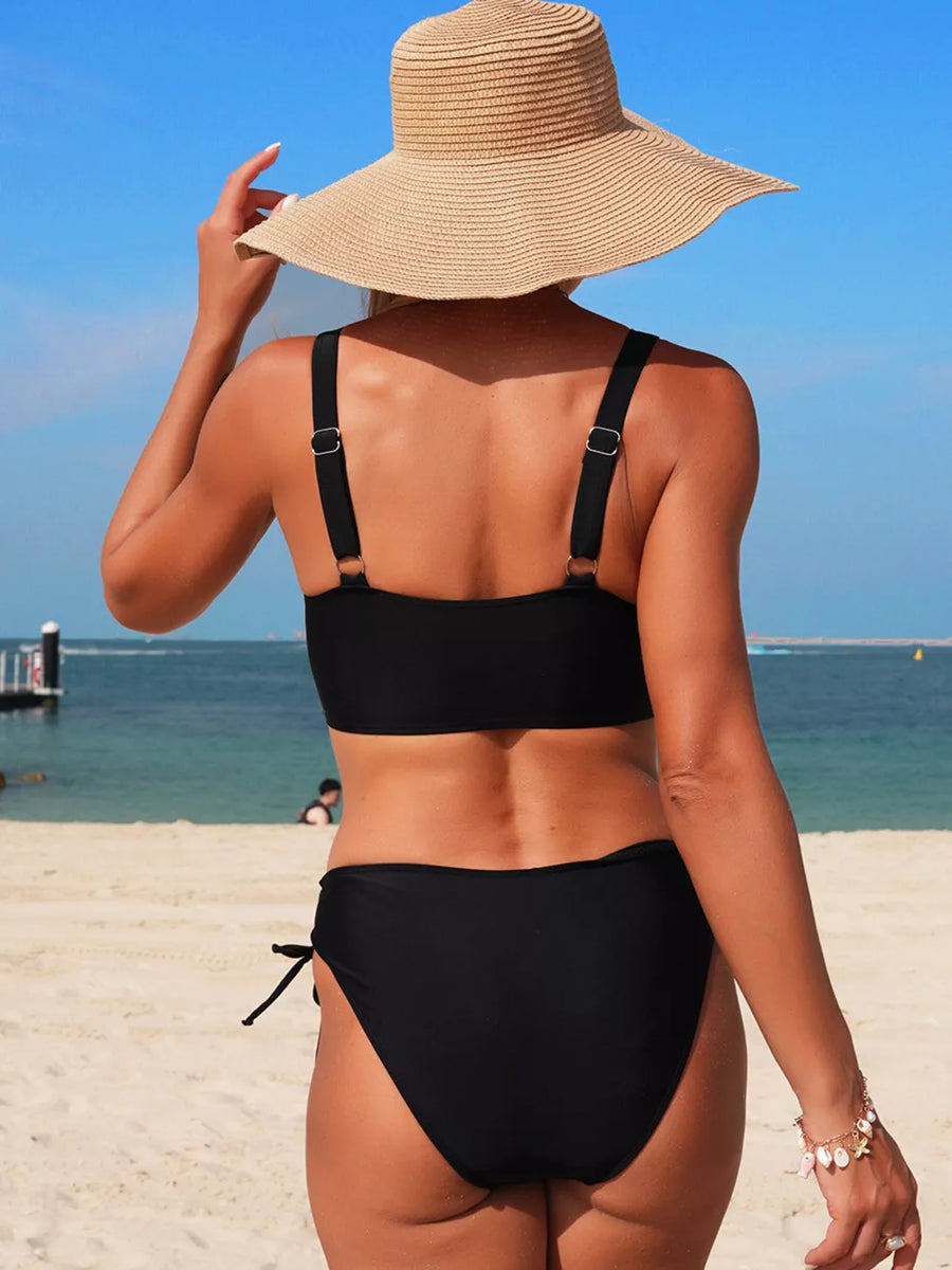 Black palm tree cutout bikini with adjustable straps and side tie bottoms.