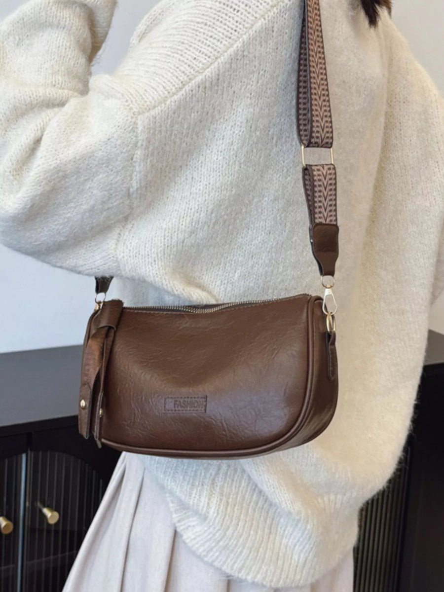 Retro shoulder crossbody bag in coffee brown faux leather with patterned strap.
