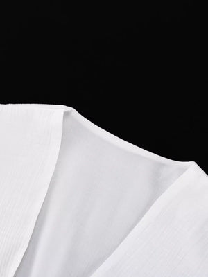 White textured fabric V-neckline blouse with subtle vertical pleats.