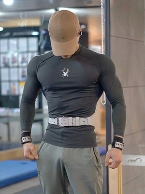 Sculpted Fit Performance Long Sleeve Top in dark grey with white spider logo, crew neck, and long sleeves.