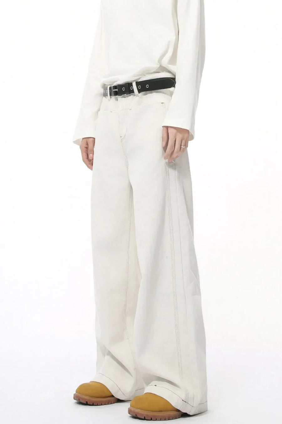 Light wash denim jeans with stitched edges and a straight-leg cut.