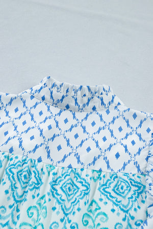 Patchwork mini dress with ruffled mock neck and blue ikat print.