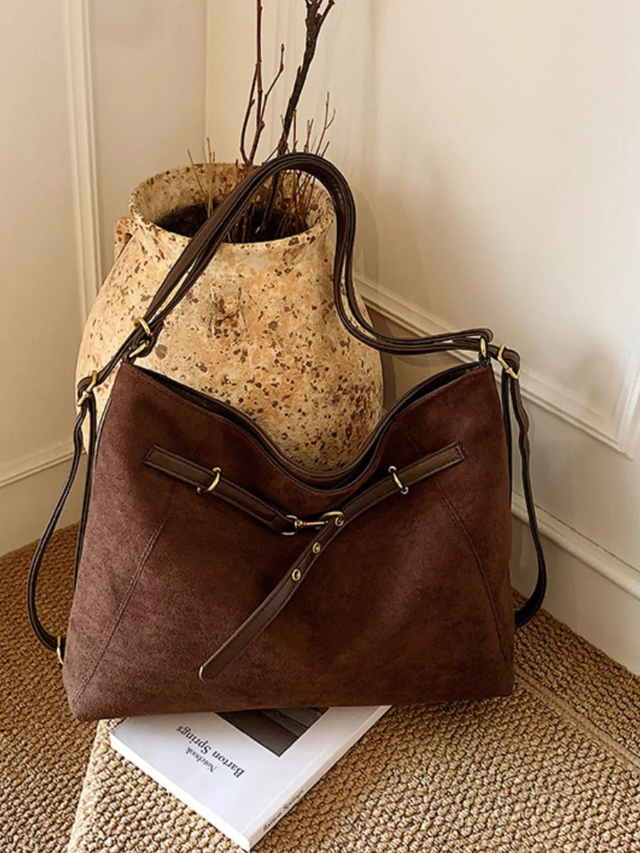 Chic brown suede large tote shopper bag with adjustable straps and gold hardware details.