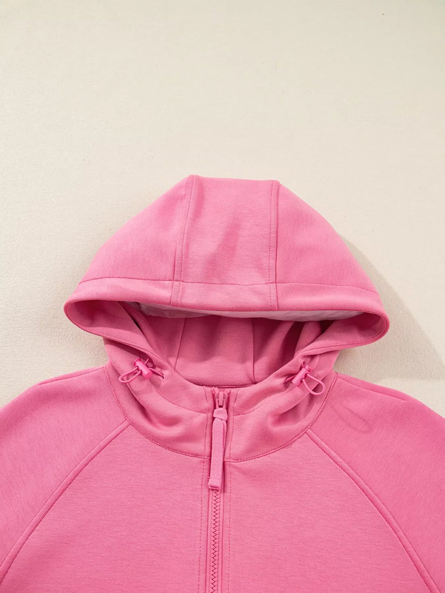 Dusty pink zip-up hoodie with drawstring hood and adjustable toggles.