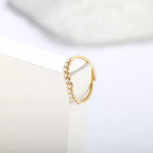 Gold adjustable ring with delicate pearl embellishments along the band.