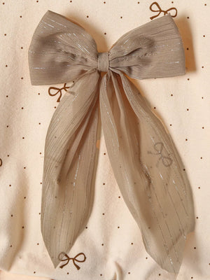 Tan baby set with polka dot pattern and large sheer bow detail.
