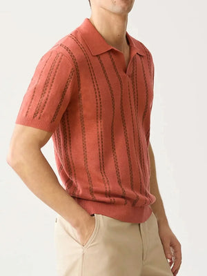 Orange-red knit polo shirt with vertical stripe pattern and spread collar.