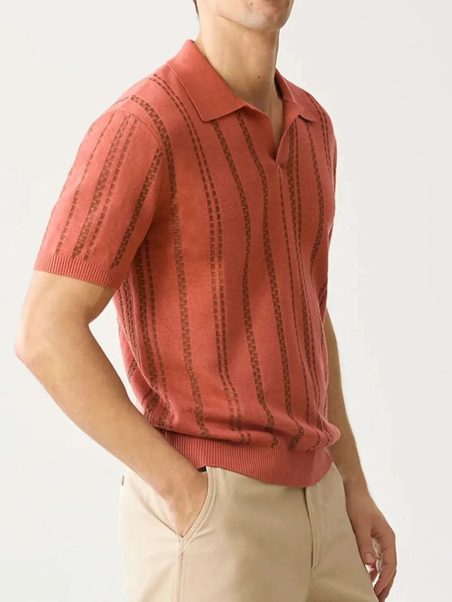 Orange-red knit polo shirt with vertical stripe pattern and spread collar.