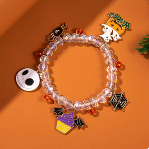 gold bracelet featuring beaded and Halloween-themed