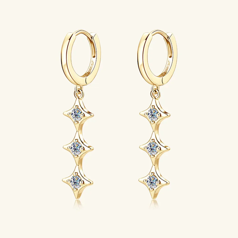 Gold hoop earrings with cascading star-shaped moissanite charms.