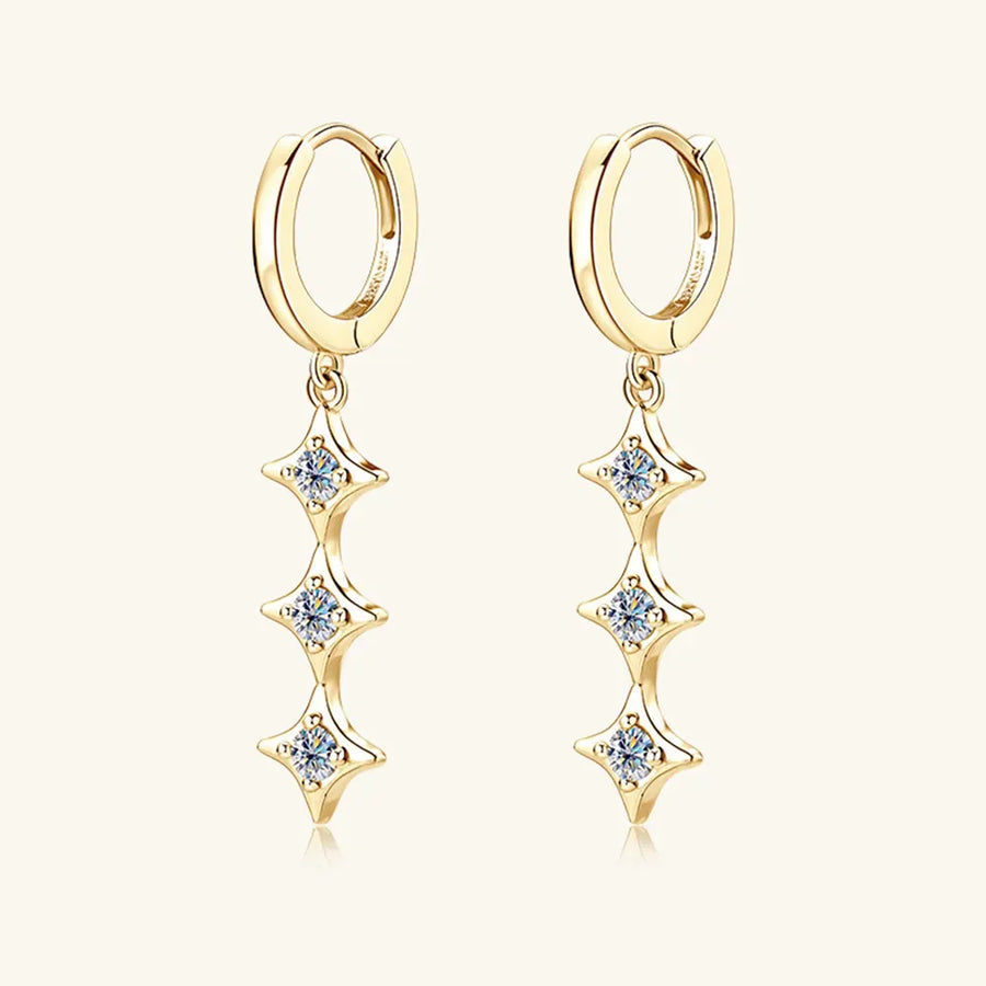 Gold hoop earrings with cascading star-shaped moissanite charms.