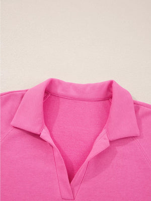 Hot pink collared pullover with V-neck detail