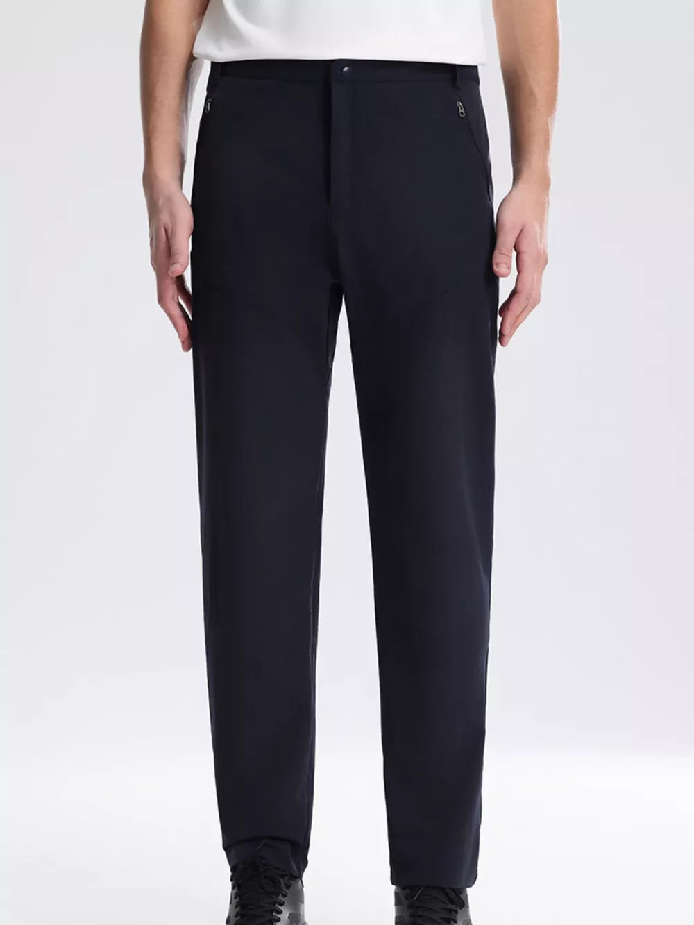 Navy blue sweatpants with zippered pockets and a comfortable fit.