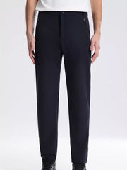 Navy blue sweatpants with zippered pockets and a comfortable fit.