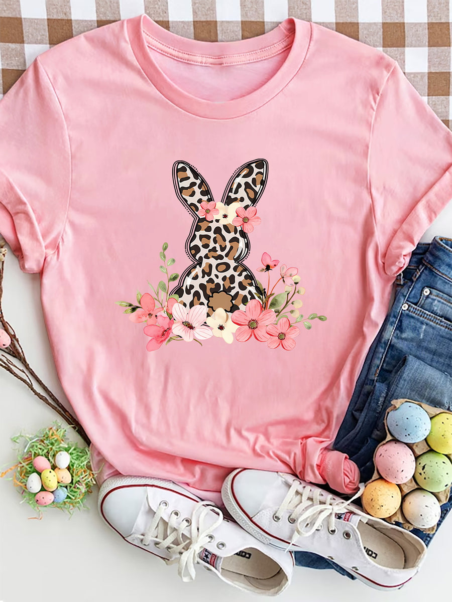Dusty pink crewneck tee with a leopard print bunny graphic surrounded by flowers.