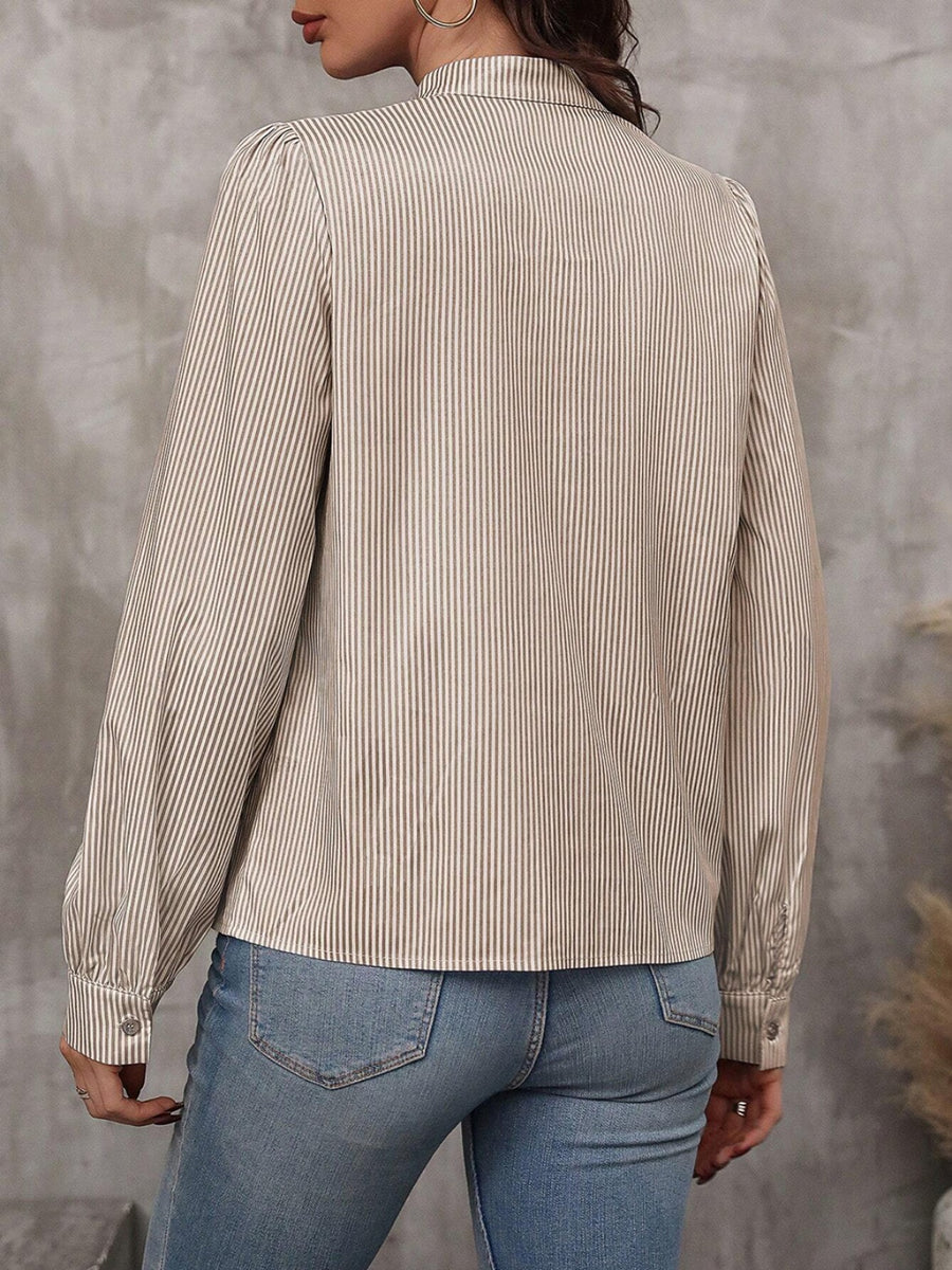 Puffed sleeve stripe blouse in khaki with button cuff and high neckline.