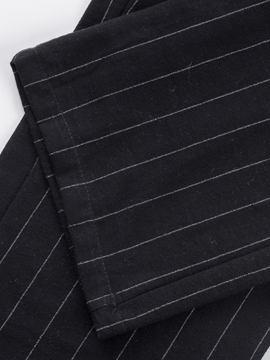Black striped sweatpants with a wide-leg cut.