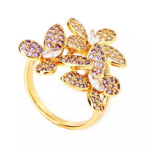 ring in Gold with floral and rhinestone embellishment