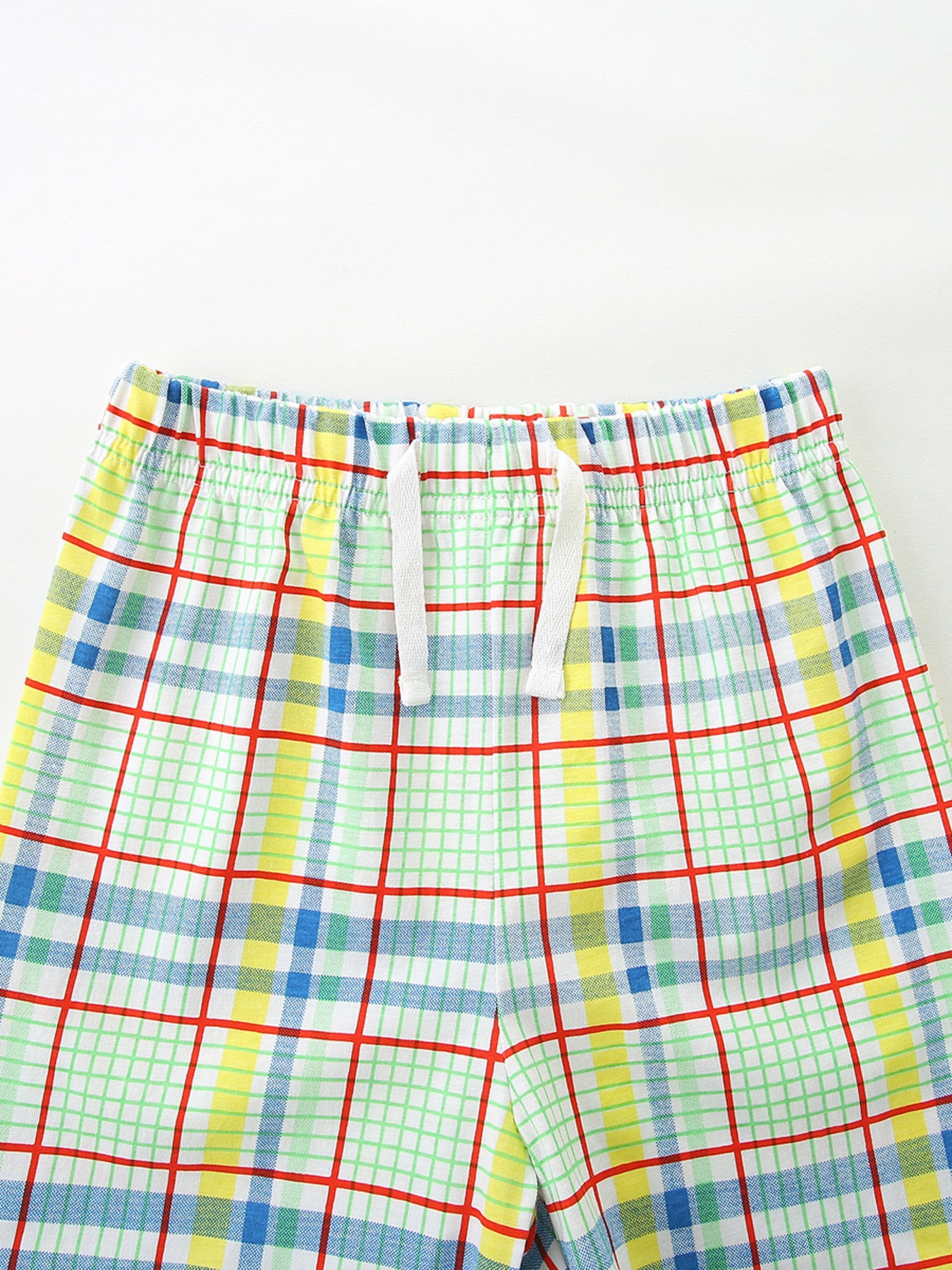 Boys' plaid cotton shorts with elastic waistband and drawstring.