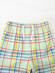 Boys' plaid cotton shorts with elastic waistband and drawstring.