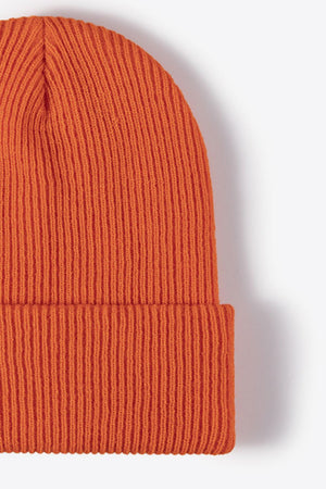 Ribbed knit beanie in Tangerine, a warm winter essential