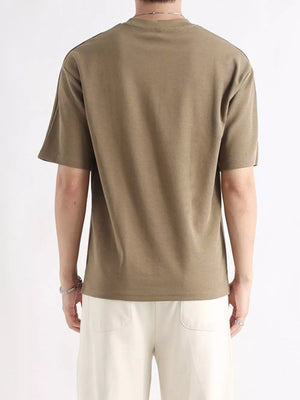Men's brown cotton t-shirt with relaxed fit and short sleeves, shown from the back.