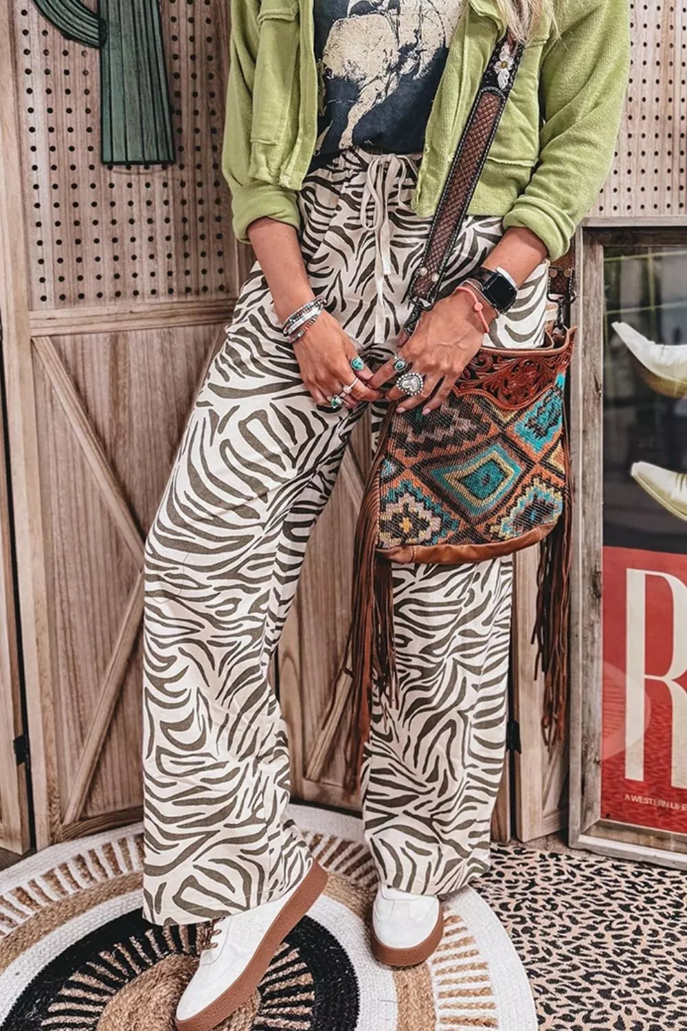 wide-leg pants featuring zebra-print in ivory with 100% polyester Care instructions: Machine wash cold texture