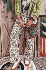 wide-leg pants featuring zebra-print in ivory with 100% polyester Care instructions: Machine wash cold texture