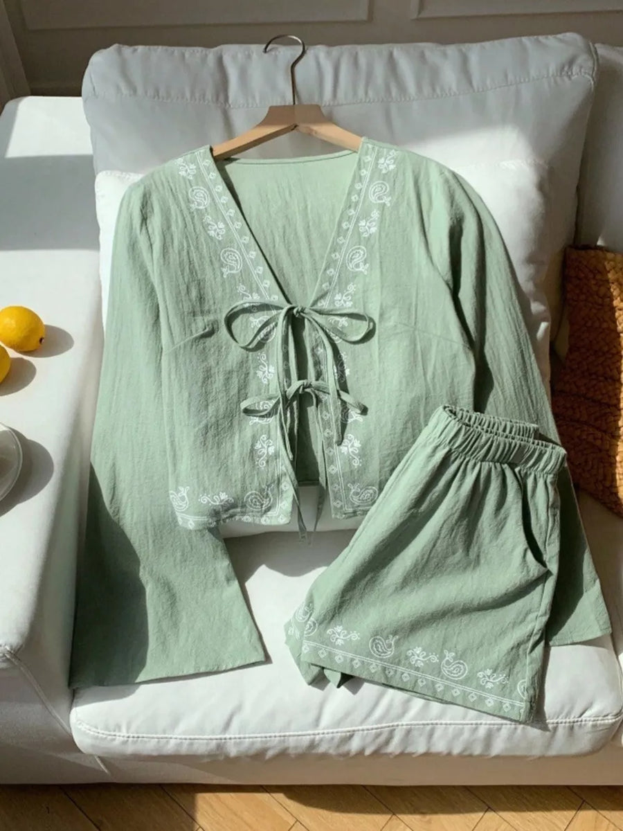Light green embroidered tie-front top and shorts set with paisley detail.