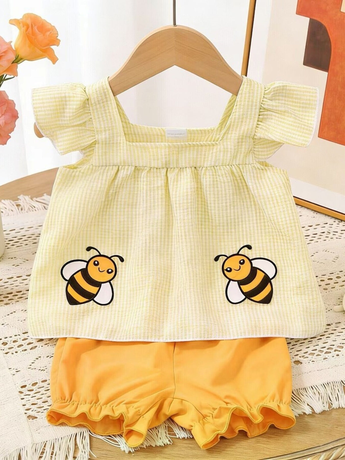 Yellow gingham baby top with bee embroidery and ruffled shorts set