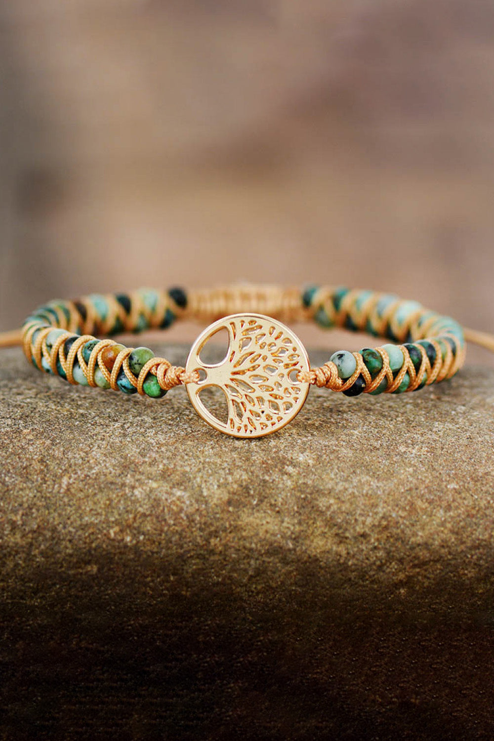 Gold Tree of Life macrame bracelet with beaded accents and intricate detail.