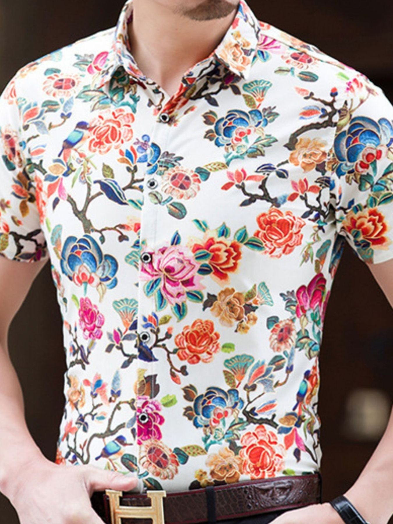 Men's white cotton button-down shirt with vibrant floral and bird print.