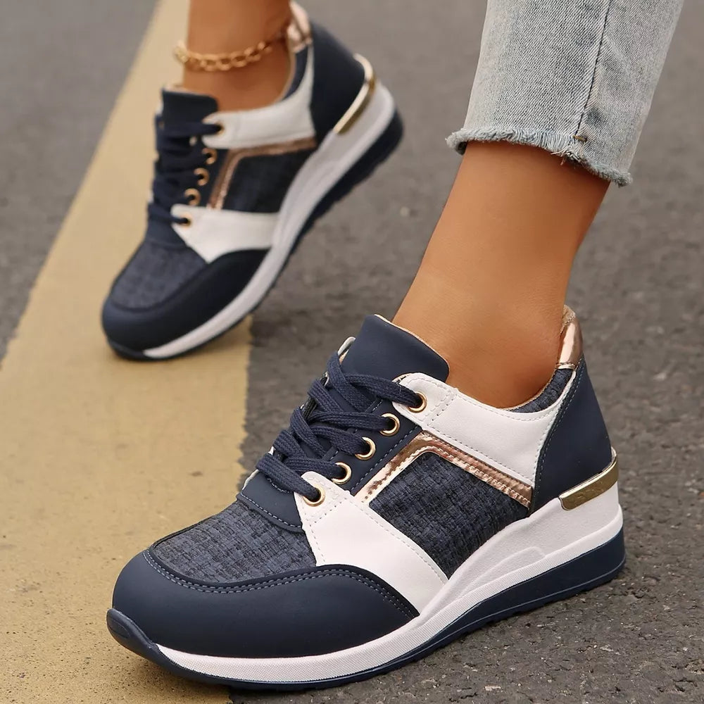 Textured lace-up sneakers in dark blue with white and metallic accents and a chunky sole.
