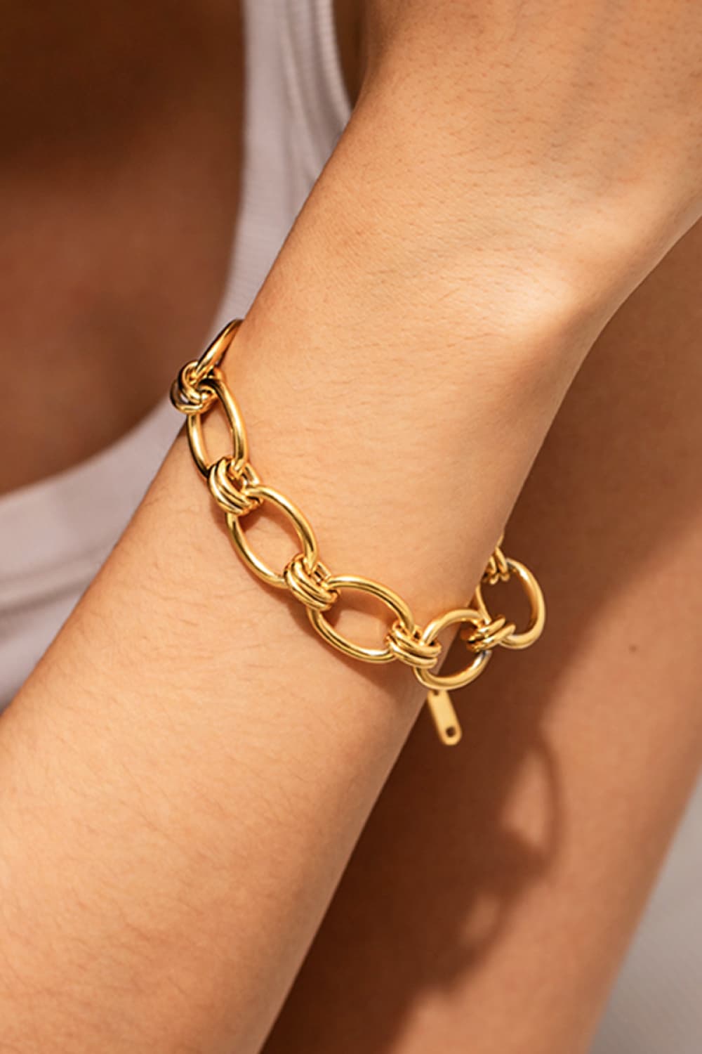Chunky gold knot link bracelet with toggle clasp, 18K gold-plated.